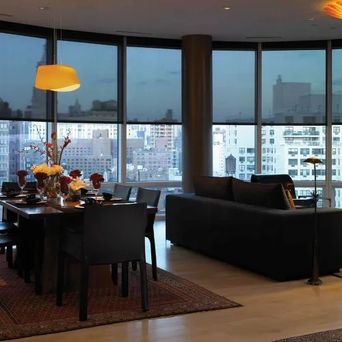 Apartment with motorized shades on floor-to-ceiling windows