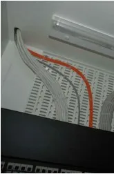 Bundled cables entering an equipment rack
